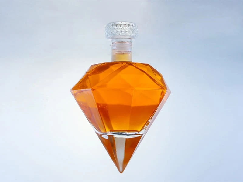 Diamond shaped glass bottle