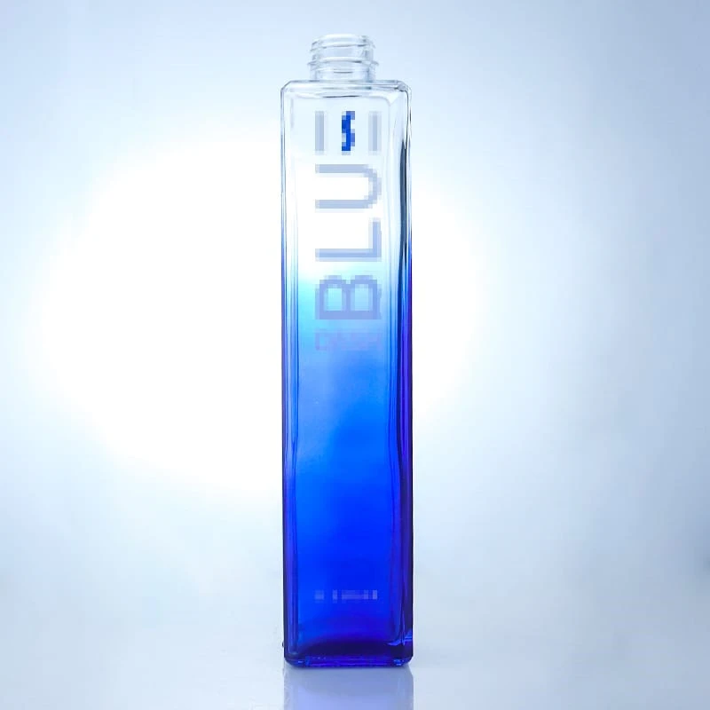 Bouteille carrée transparente de couleur bleue avec col court à vis