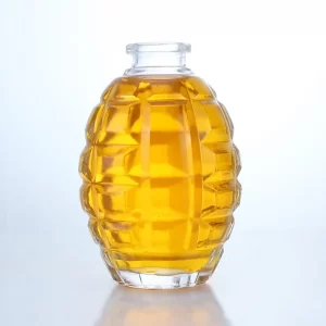 426-Unique 100ml 200ml grenade shaped glass bottle with lids