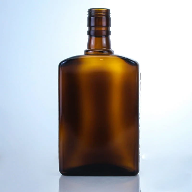 489-flat shape embossed on side screw cap glass bottle