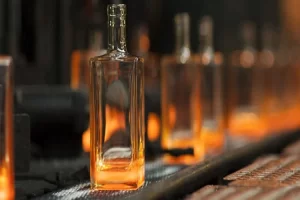 What are the problems encountered in the production of glass bottles?