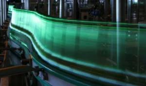 Why are most beers packaged in green glass bottles?